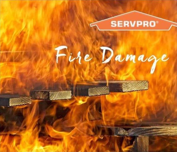 Wood on fire with SERVPRO logo 